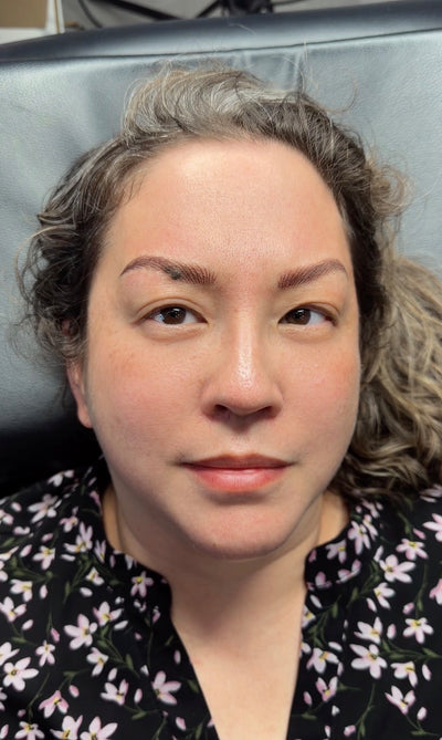 Client smiling after permanent makeup brow treatment at AM Permanent Makeup & Med Spa, Murphy TX